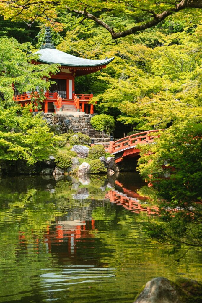 red temple near body of water