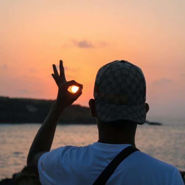 man standing near ocean