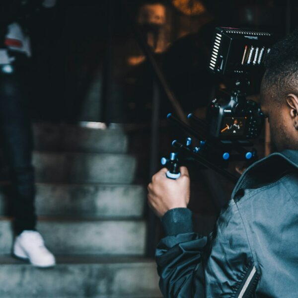 man taking photo of another man