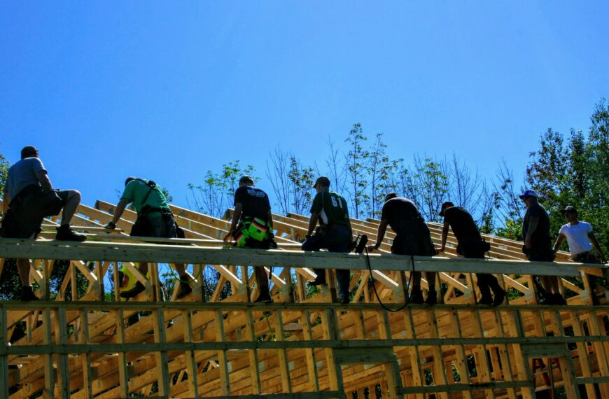 men standing on house frame