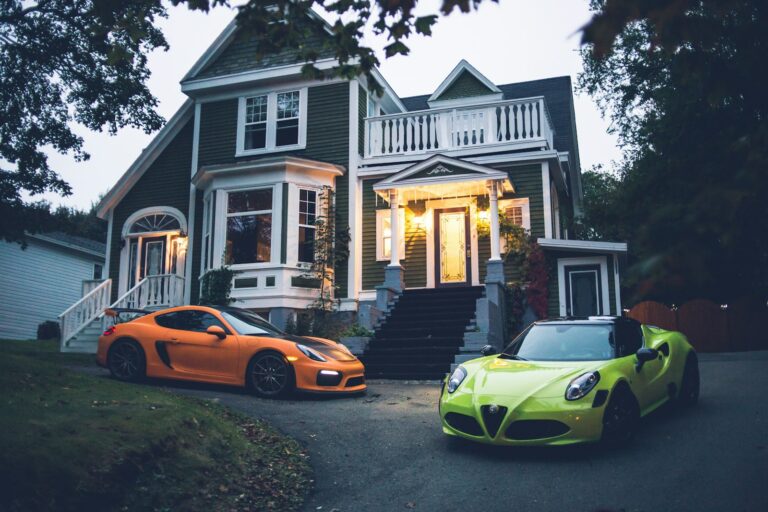 yellow lamborghini aventador parked in front of white and gray house