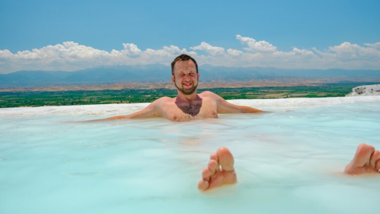 a man laying in a large pool of water